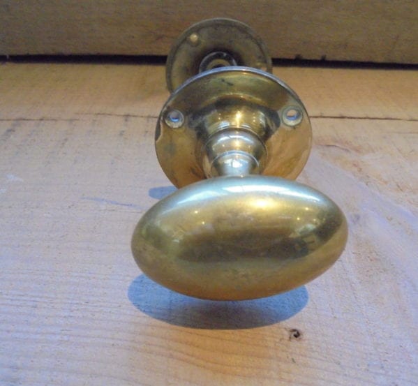 Oval brass door knob set