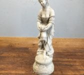 Reconstituted Lady Holding Bird Statue