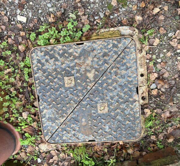 Pair of "Python" Square Manhole Covers
