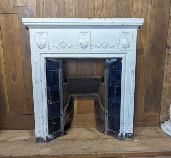 White Painted Fireplace with Blue Tiles