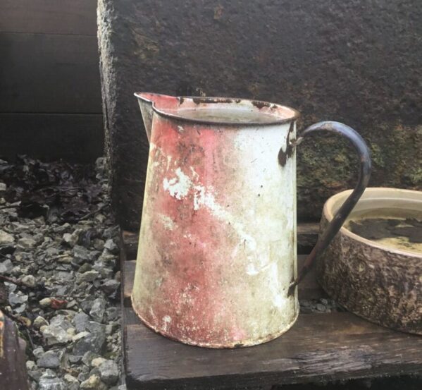 Red And White Metal Jug