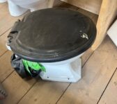 Toilet with Black Seat