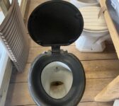 Toilet with Black Seat