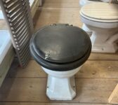 Toilet with Black Seat