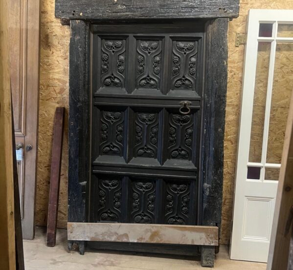 Reclaimed Antique Tudor Style Carved Solid Oak Door in Heavy Oak Surround